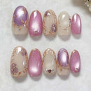 Set of decorative nails with pink, purple, and gold designs on a white background, Obroi