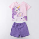 Children's outfit with pink shirt featuring a unicorn and purple shorts on a white background, Obroi