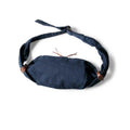 Navy blue eye mask with brown straps on a white background, Obroi