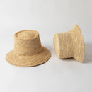 Two woven straw hats on a light gray background, Obroi