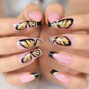 Nails with black and gold butterfly design on a neutral background, Obroi