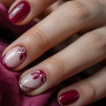 Close-up of a hand with red and white nail polish on a dark background, Obroi