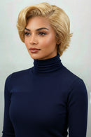 Woman wearing a blonde wig against a light background, Obroi