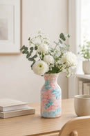 Decorative vase with floral arrangement on a wooden table, Obroi