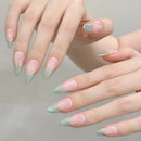 Close-up of hands with pastel nail polish on a neutral background, Obroi