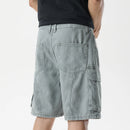 Person wearing light gray denim shorts on a white background, Obroi