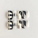 Set of black and white nail art designs on a light gray background, Obroi