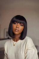 Woman with a stylish haircut and neutral background, Obroi