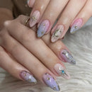 Close-up of hands with decorative nail art on a soft background, Obroi