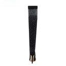 Black knee-high boot with sparkling detail on a white background, Obroi