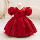 Red velvet dress on a mannequin against a white background, Obroi