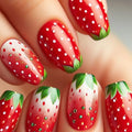 Nails with strawberry design on a neutral background