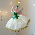 Decorative fairy figurine with green wings and dress on a plain background, Obroi