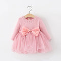 Pink dress with a large bow on a white background, Obroi