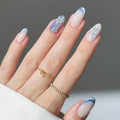 Hand with decorative nails and a gold ring on a neutral background, Obroi