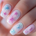 Nails with colorful firework design on a light background, Obroi
