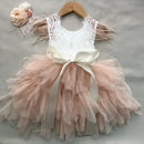 Pink tutu dress with lace top and bow on a gray background, Obroi