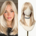 Blonde wig on a mannequin head next to a woman with similar blonde hair, Obroi