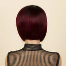 Person wearing a burgundy bob wig with 'Obroi' branding on a beige background