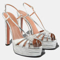 Silver high-heeled platform sandals on a white background, Obroi