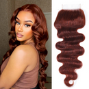 Woman with styled hair next to a bundle of red hair extensions, Obroi