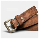 Brown leather belt with intricate designs and a brass buckle on a light gray background, Obroi