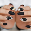 Black nails with decorative elements on a neutral background ,Obroi