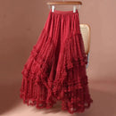 Red tiered skirt on a chair against a brown background, Obroi