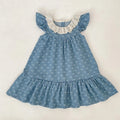 Blue denim dress with white ruffled collar on a light background, Obroi