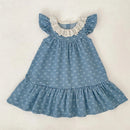 Blue denim dress with white ruffled collar on a light background, Obroi