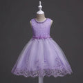 Lavender lace dress on a mannequin against a dark background, Obroi