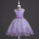 Lavender lace dress on a mannequin against a dark background, Obroi
