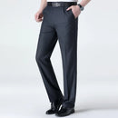 Dark gray dress pants worn by a person on a white background, Obroi
