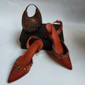 Brown embellished shoes and handbag on a white background, Obroi