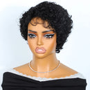 A mannequin bust wearing a short, curly black wig with a lace front and dramatic eye makeup, styled with a delicate necklace and a black off-the-shoulder top against a plain light background, Obroi