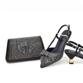 Black studded high-heeled shoes with a matching clutch on a white background, Obroi