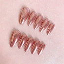 Set of rose gold nail extensions on a pink glittery background, Obroi