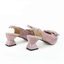 Pink snake print high-heeled shoes on a white background with 'Obroi' branding.