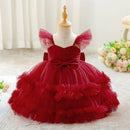 Red tulle dress on a mannequin with a soft white background, Obroi