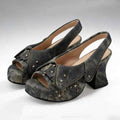Pair of gray suede platform shoes with star and zipper details on a white background, Obroi
