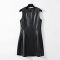 Black leather dress on a hanger against a white background, Obroi
