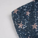 Close-up of a blue fabric with star patterns on a gray background, Obroi