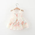 Floral dress on a hanger against a white background, Obroi