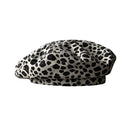 A black and white leopard print beret hat on a solid white background, Obroi