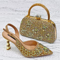 Gold embellished handbag and shoe on a textured white surface, Obroi