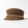 Brown hat with a gold chain band on a white background, Obroi