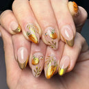 Nails with pumpkin and leaf designs on a neutral background, Obroi