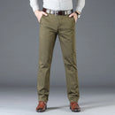 Person wearing olive green pants with a gray background, Obroi