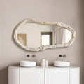 Bathroom with a modern vanity, round mirror, and decorative items, Obroi