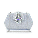 Silver clutch bag with gemstone embellishment on a white background, Obroi